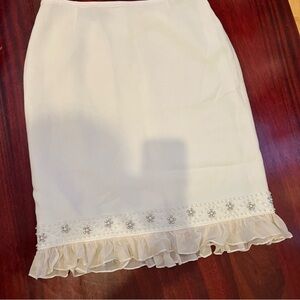 Tahari Shirt Cream Color with pearls , Rhinestones and ruffle Bottom